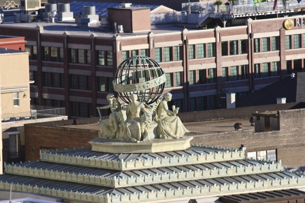 Statues atop the corners of the US Court of Appeals building